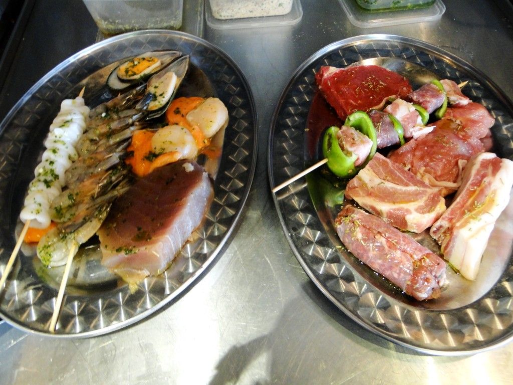 Mixed Grilled Seafood and Meat Dishes, ready for the char-grill, Francesca's