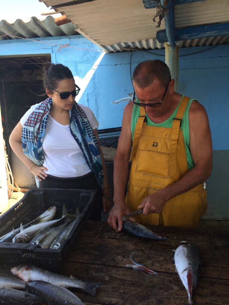 Nadia Sammut with Josie Ortiz, cleaning the mullet and removing the bottarga