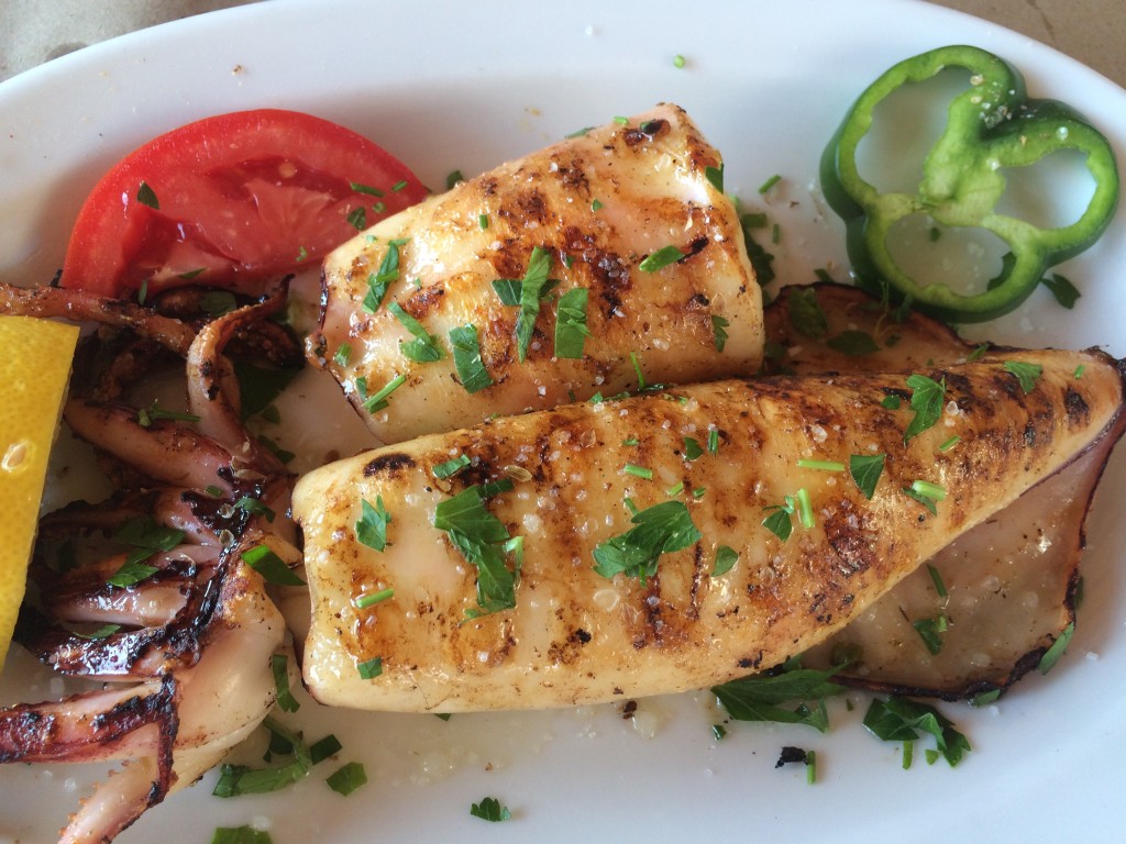 Whole grilled calamari, just one of many delicious seafood dishes at Saloutso Tavern